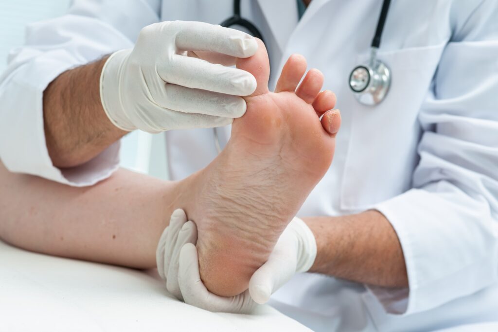 a provider looking at a person's toenails